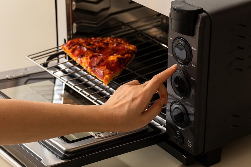 Does The Oven's Manufacturing Residue Pose Health Risks If Not Properly Cleaned Before Cooking?