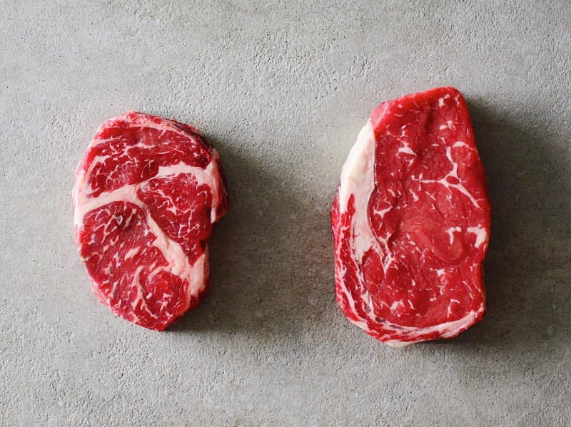 What Are The Key Differences Between Chuck Eye vs Ribeye Steaks