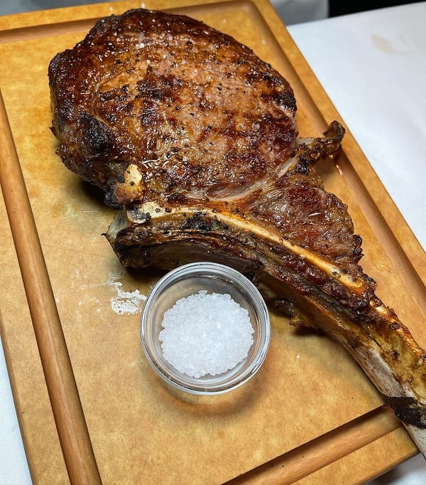 How Is A Tomahawk Steak Cut And Prepared, And What Cooking Methods Work Best For This Type Of Steak