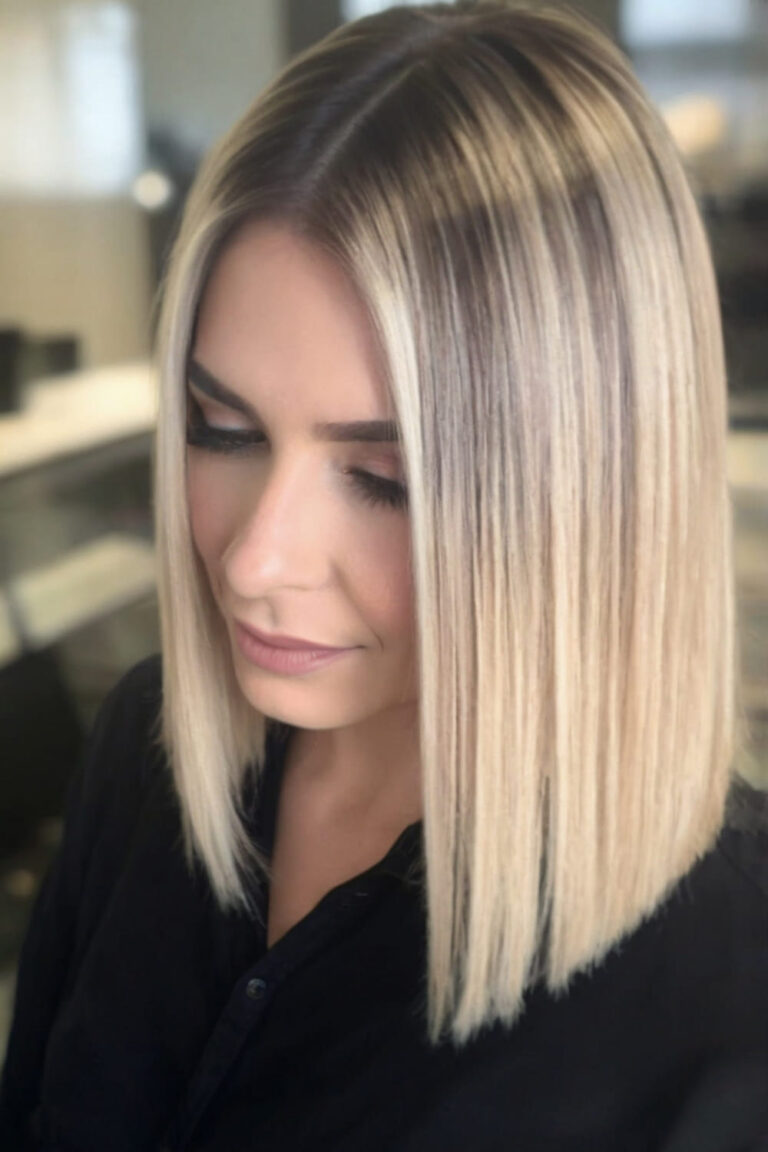 Blunt lob with dark roots highlighting the fine straight hair texture