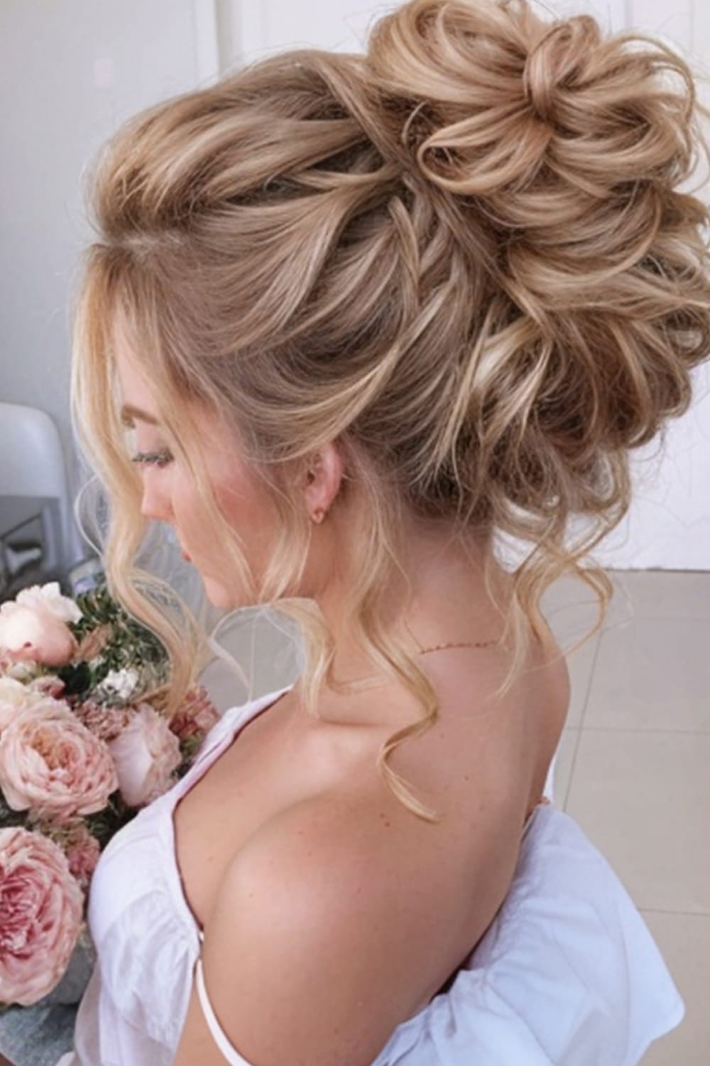 High Bun with Loose Curls